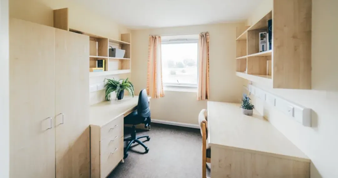 The Quays Bedroom designed with privacy and comfort in mind, featuring a single bed and an en-suite bathroom