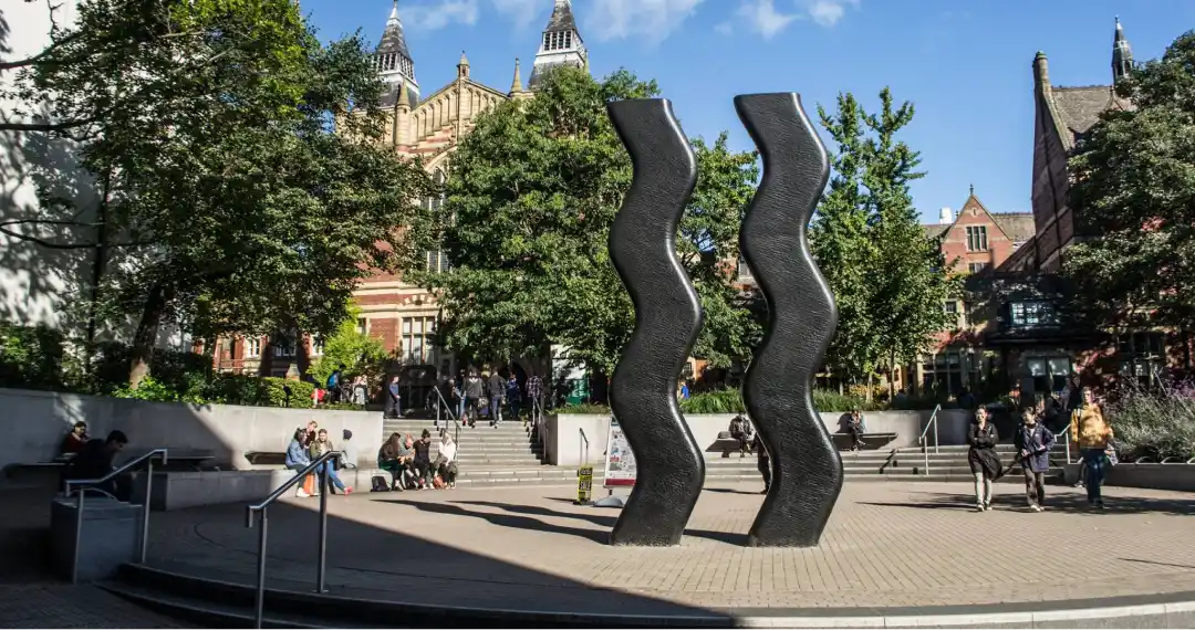 The "Wavy Bacon" statue is "Sign for Art," was created by the artist Hubert Dalwood in 1962