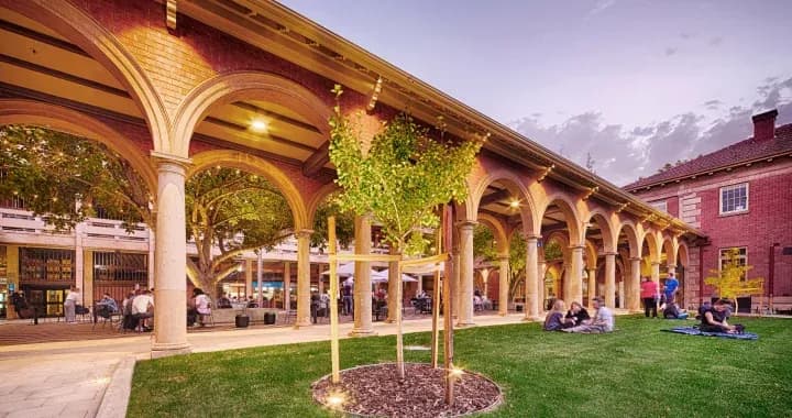 The historic Memorial Cloisters arches and the UniBar at the back